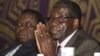 Zimbabwean Prime Minister Morgan Tsvangirai, left, and President Robert Mugabe, Harare, November 2011.