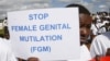Masai girl holds protest sign during anti-Female Genital Mutilation (FGM) run in Kilgoris, Kenya