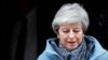 FILE - Britain's Prime Minister Theresa May leaves 10 Downing Street, as she faces a vote on alternative Brexit options, in London, Britain, March 27, 2019.