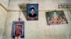 A portrait of Parasuraman Thulasiyamma's missing son is displayed with pictures of Hindu deities inside their home in Mullaitivu, Sri Lanka, May 7, 2024. Sri Lanka's civil war ended 15 years ago, but many people are still searching for missing family members.