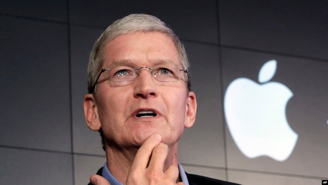 FILE – Apple CEO Tim Cook. Tens of thousands of Indian developers design apps for Apple devices.
