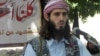 American-born Islamist militant Omar Hammami, 27, speaks during a news conference held by the militant group al-Shabab at a farm in southern Mogadishu's Afgoye district in Somalia. (May 11, 2011 file photo)