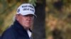 President Donald Trump, in center cart, participates in a round of golf at the Trump National Golf Course, Nov. 7, 2020, in Sterling, Va.