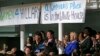Women attending a Women for Hillary event react as Democratic presidential candidate Hillary Clinton speaks at at the New York Hilton hotel in midtown Manhattan one day ahead of the New York primary, April 18, 2016. 