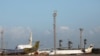FILE - Planes are seen at Mitiga Airport in Tripoli, Libya, Dec. 12, 2019.